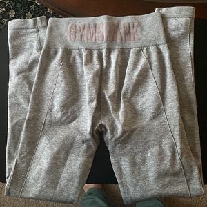 Grey with Pink Gymshark logo leggings. Flex
